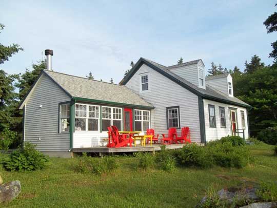 Heritage Cape Cod home after renovation: new dormer windows, new living space in former attic