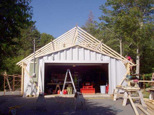 Renovation job to coverup existing Quonset hut with roof trusses and side walls