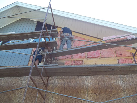 New batt insulation installed in exterior repaired wall.