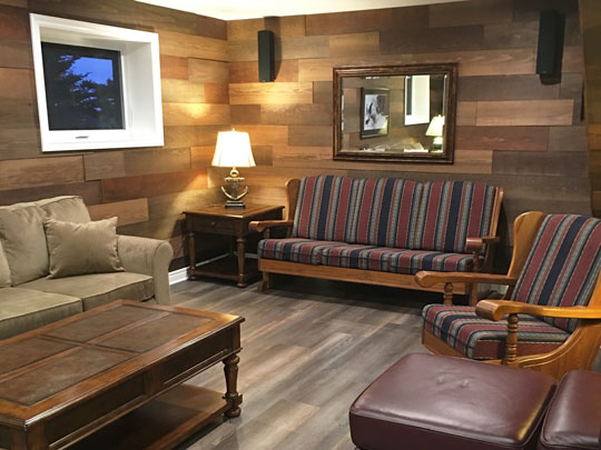 Basement space transformed into comfortable family room. Work by Mark Oickle Construction.