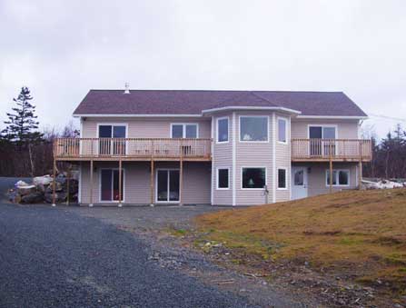 New two-storey home with bay window and deck, built by Mark ickle Construction