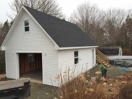 New garage with storage loft with exterior stairs. Built by Mark Oickle Construction